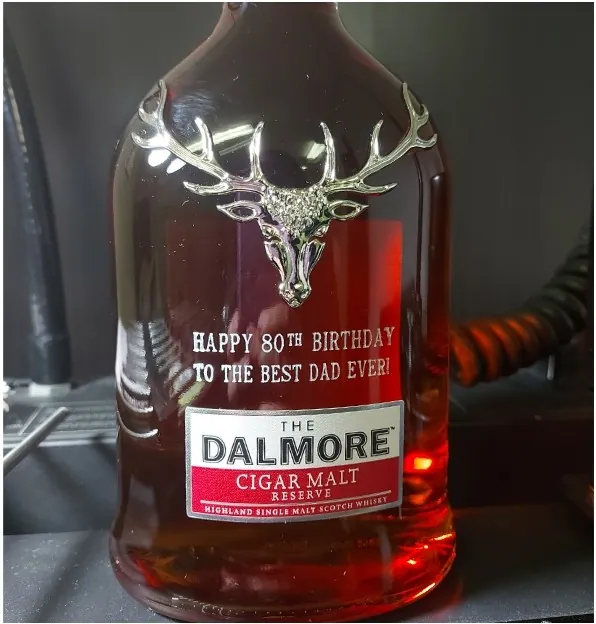 Whisky bottle engraved with a happy 80th birthday message for Dad