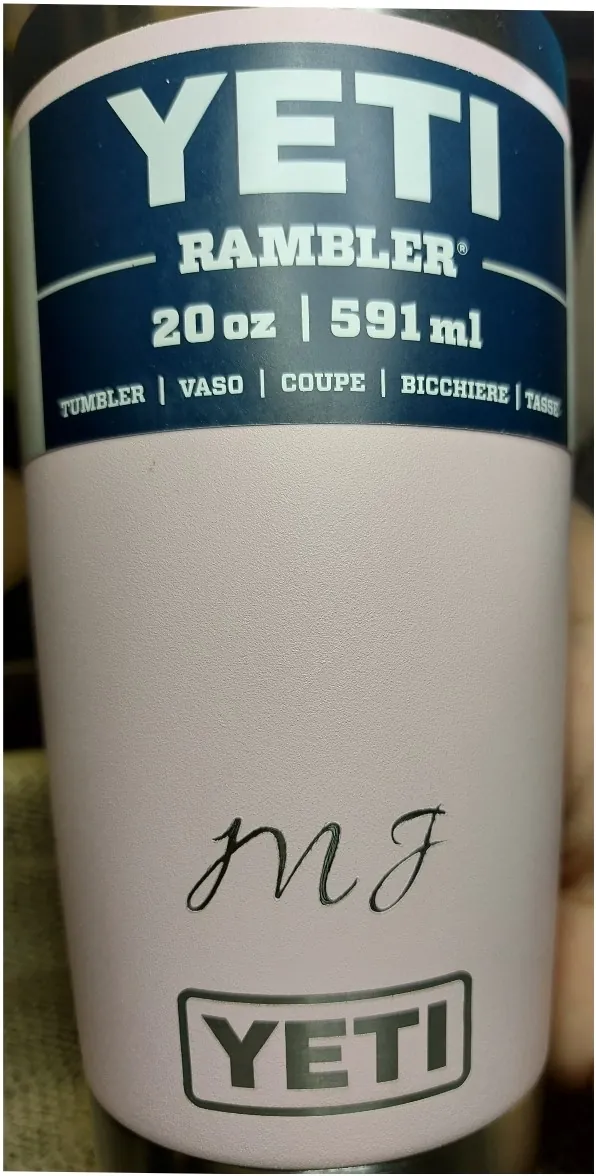 Pink YETI tumbler engraved with script initials
