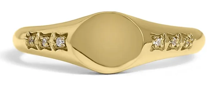 Gold round signet ring with cubic zirconia accents on the band